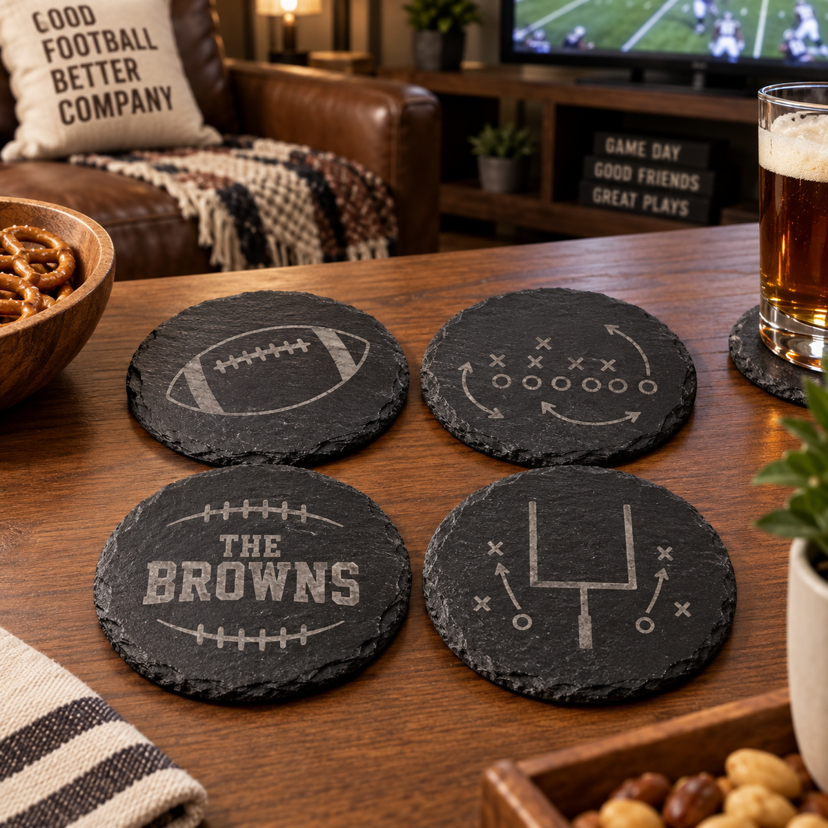 Set of four engraved black slate football coasters